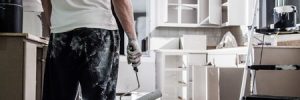 Man Painting Modern Kitchen